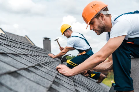 men working on roof