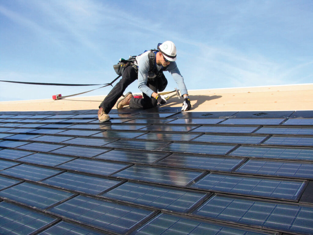 man repairs the roof