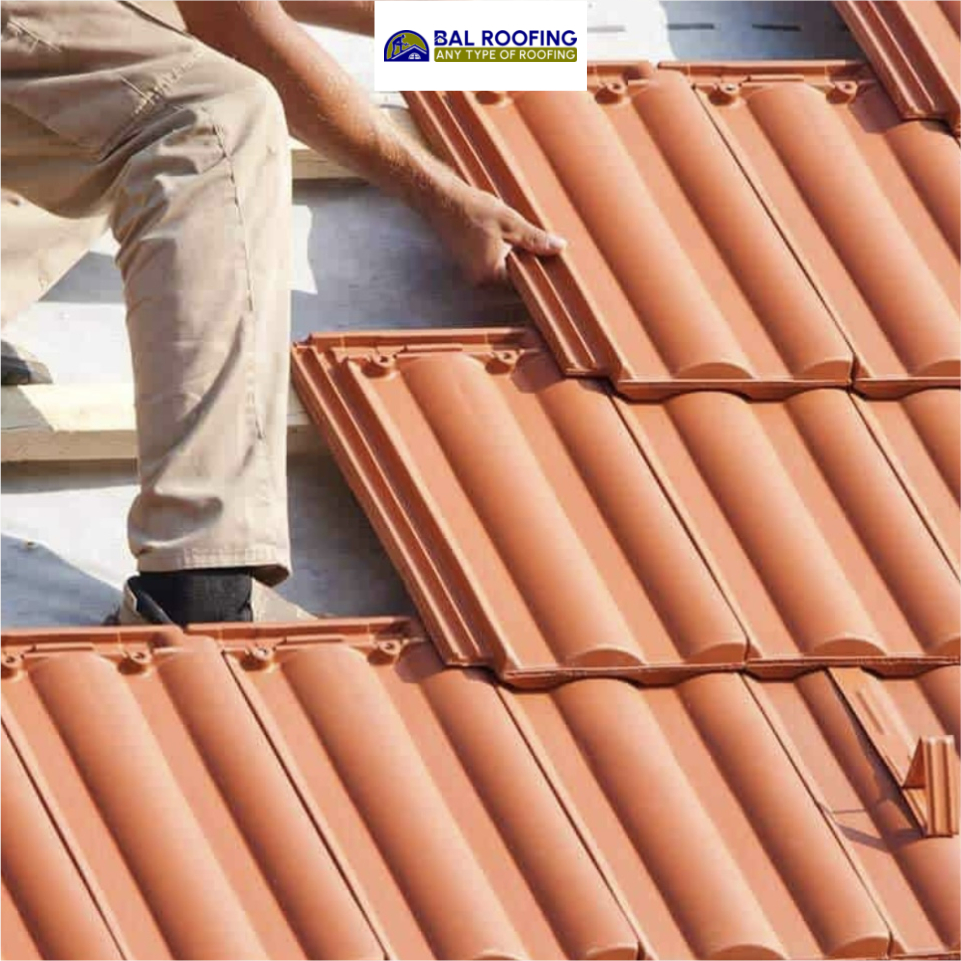 Bal Roofing professional installing clay tile roofing on residential home
